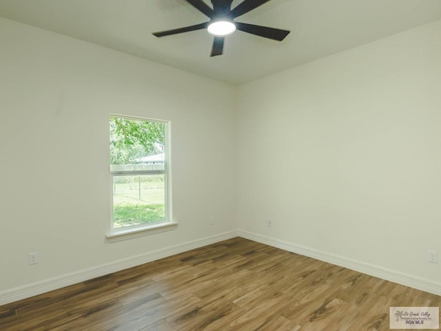 23100 Hidalgo Ave, Harlingen, TX 78552 - empty room featuring wood finished floors, ceiling fan, and baseboards