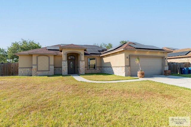 prairie-style home featuring a garage and a front yard