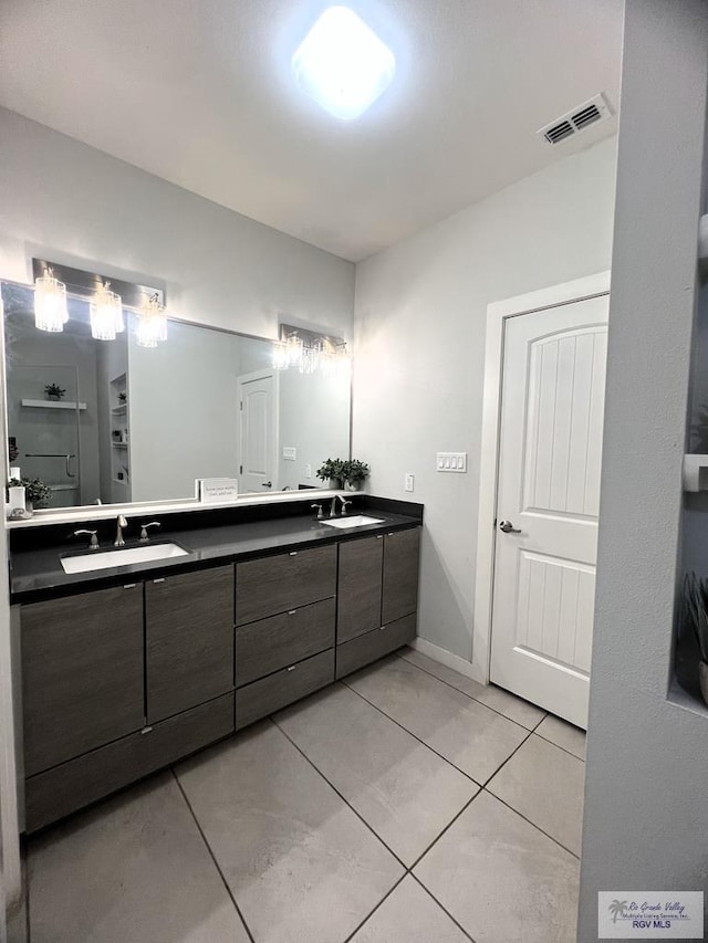 bathroom with tile patterned flooring and vanity