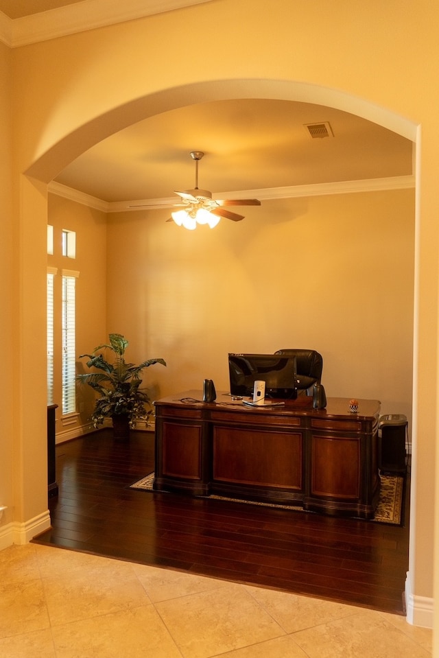 office featuring light hardwood / wood-style flooring, ceiling fan, and crown molding