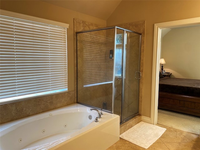 bathroom featuring tile patterned flooring, vaulted ceiling, and plus walk in shower