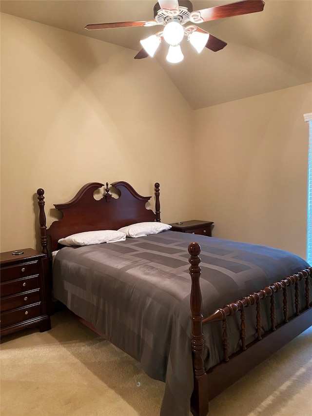 carpeted bedroom featuring ceiling fan and lofted ceiling