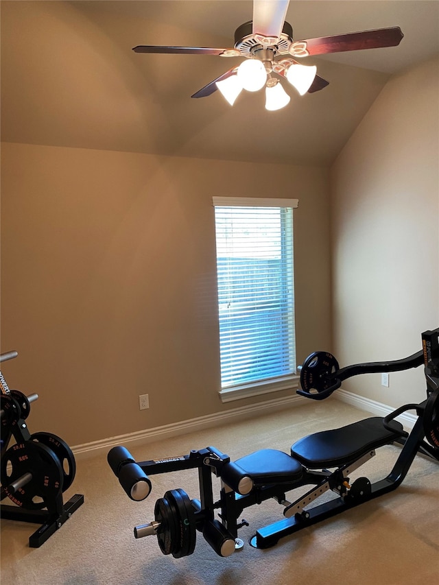 workout area featuring vaulted ceiling and ceiling fan