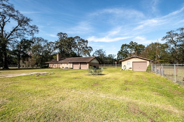 view of yard featuring a garage