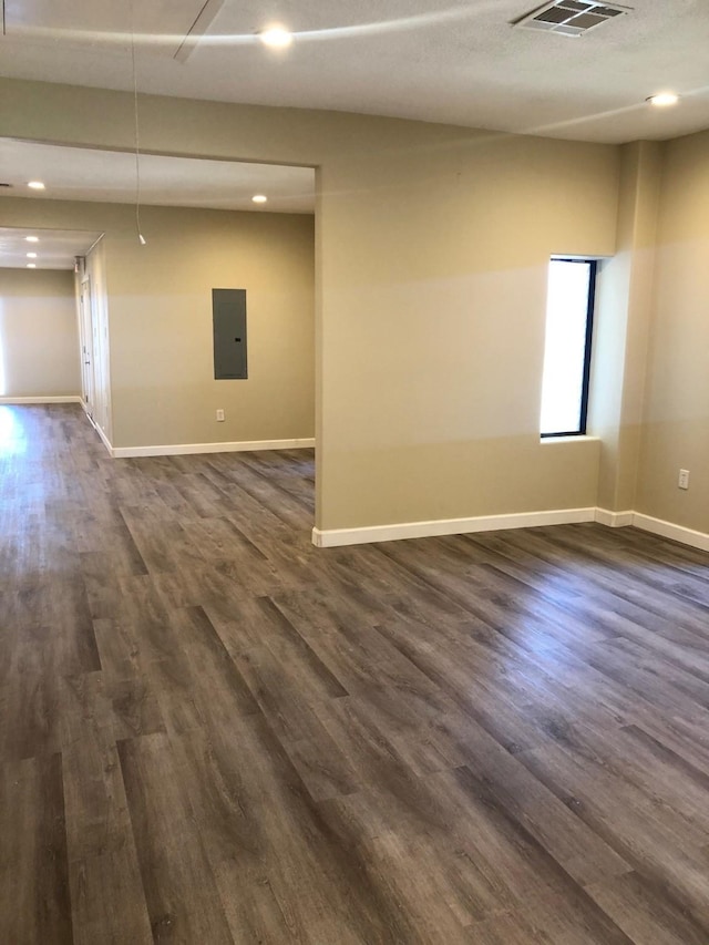 unfurnished room featuring dark hardwood / wood-style floors