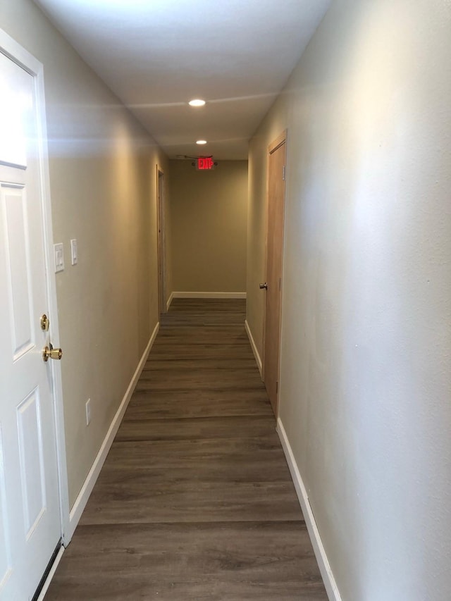 corridor with dark wood-type flooring