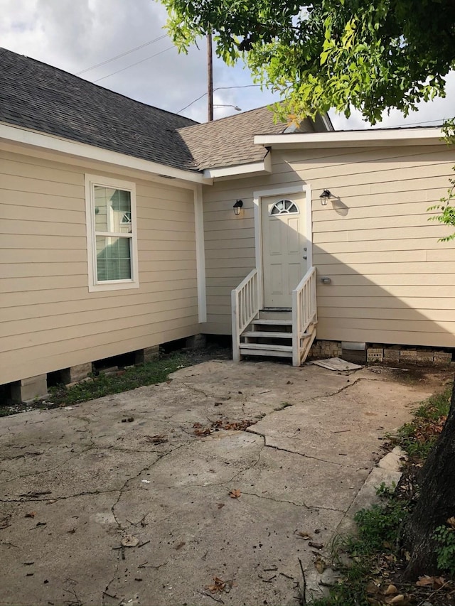 back of property with a patio