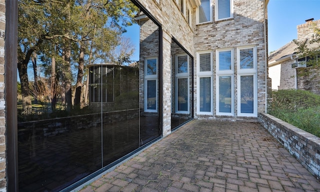 doorway to property with a patio