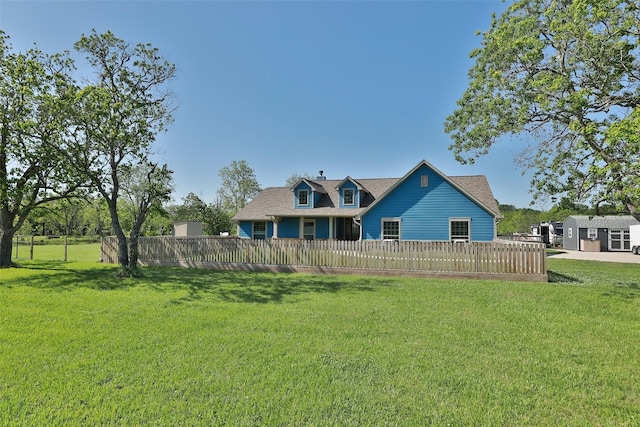 back of house with a lawn