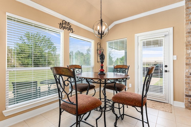 dining area with light tile floors, a notable chandelier, brick wall, and crown molding