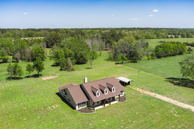 birds eye view of property with a rural view