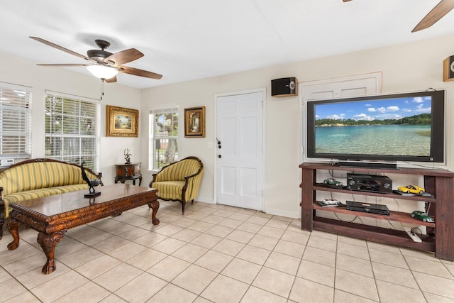 living area with ceiling fan and light tile floors