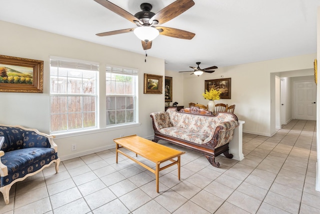 tiled bedroom with multiple windows and ceiling fan