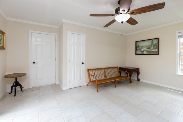 living area featuring light tile flooring, ornamental molding, and ceiling fan