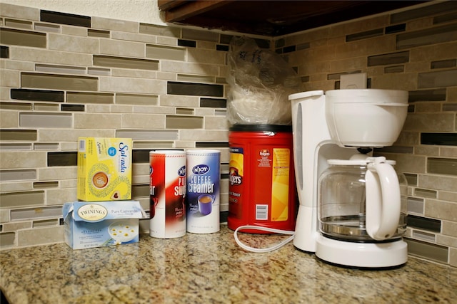 interior space featuring tasteful backsplash and toilet