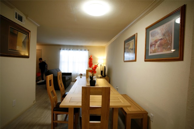 dining area featuring ornamental molding