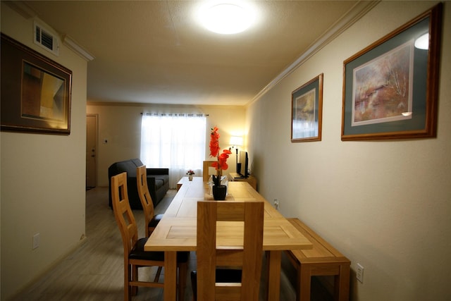 dining room featuring ornamental molding