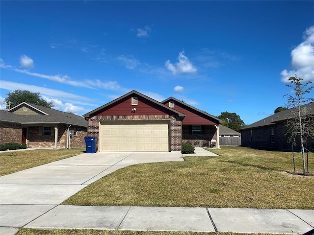 view of front of property featuring a front lawn and a garage