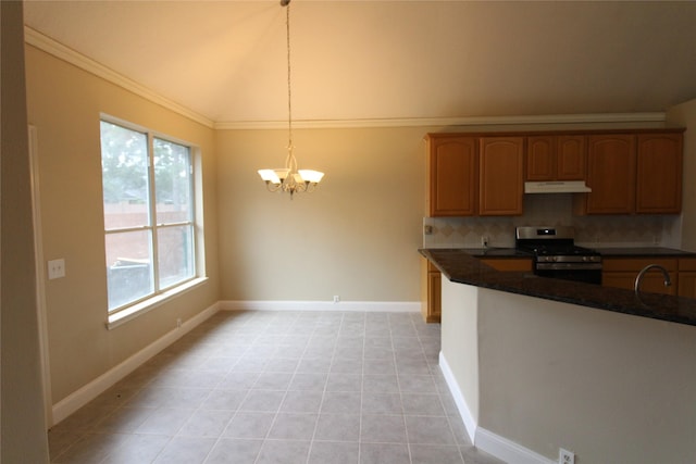 kitchen featuring stainless steel range oven, pendant lighting, backsplash, light tile flooring, and a notable chandelier