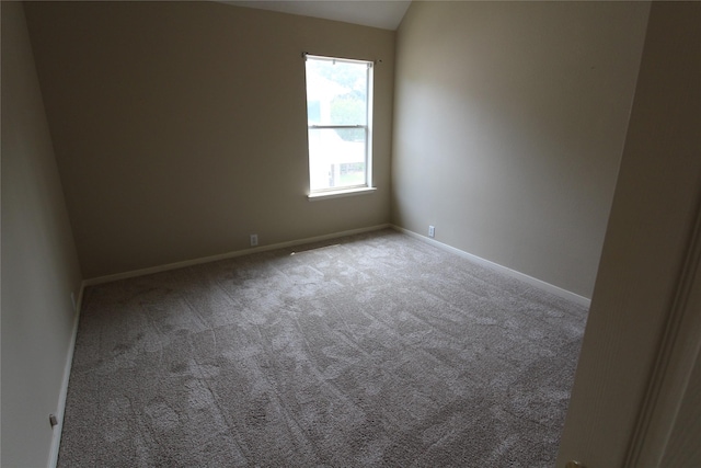 unfurnished room with light colored carpet