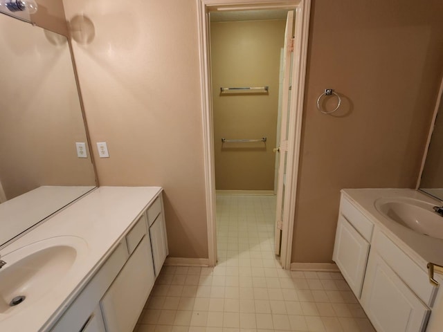 bathroom featuring tile flooring and vanity