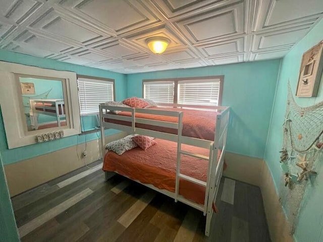 bedroom featuring dark hardwood / wood-style flooring