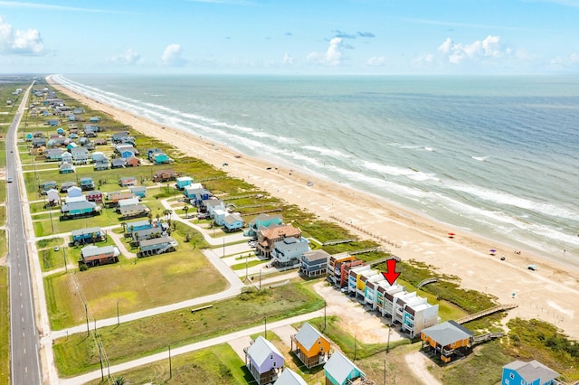 bird's eye view with a water view and a view of the beach