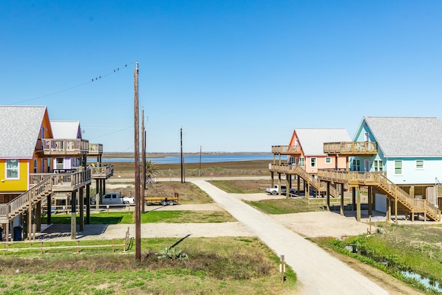 view of jungle gym with a deck with water view