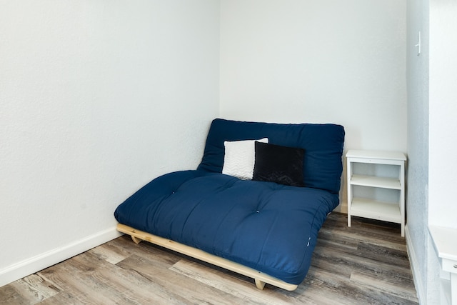 bedroom with dark hardwood / wood-style flooring