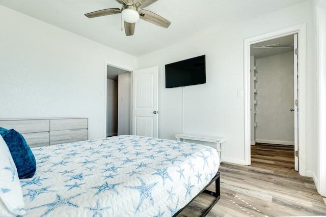 bedroom featuring ceiling fan and light hardwood / wood-style flooring