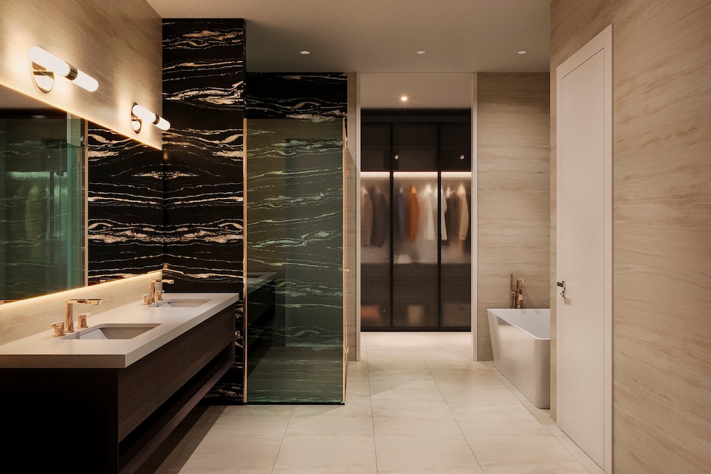 bathroom with tile walls, tile flooring, dual sinks, a tub, and oversized vanity