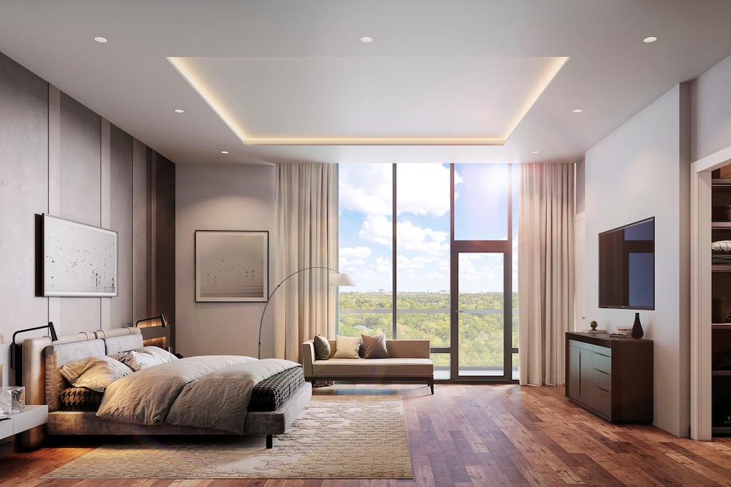 bedroom featuring floor to ceiling windows, dark hardwood / wood-style floors, and a tray ceiling