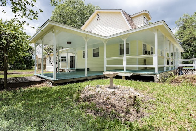 rear view of house with a lawn