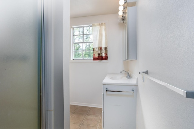 bathroom with vanity and tile floors