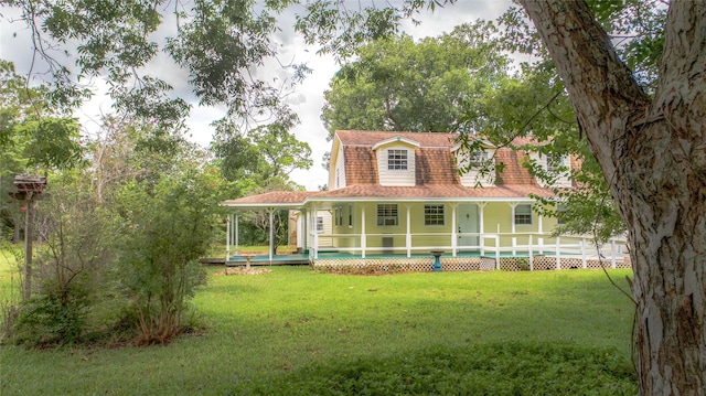 farmhouse inspired home with a porch and a front lawn