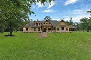 back of house with a lawn