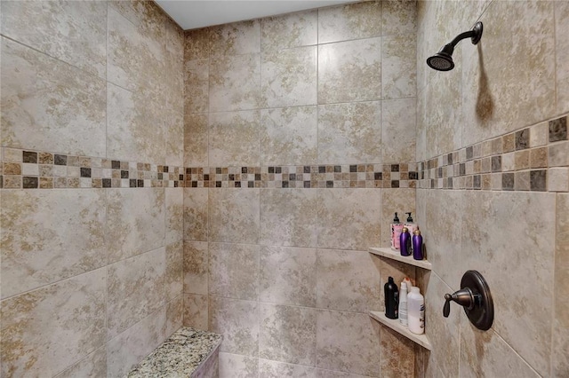 interior space featuring tiled shower