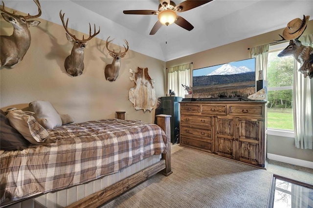 bedroom with ceiling fan and light carpet