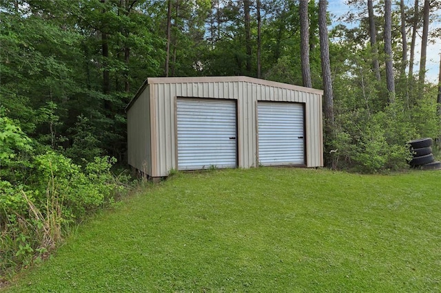 garage featuring a lawn