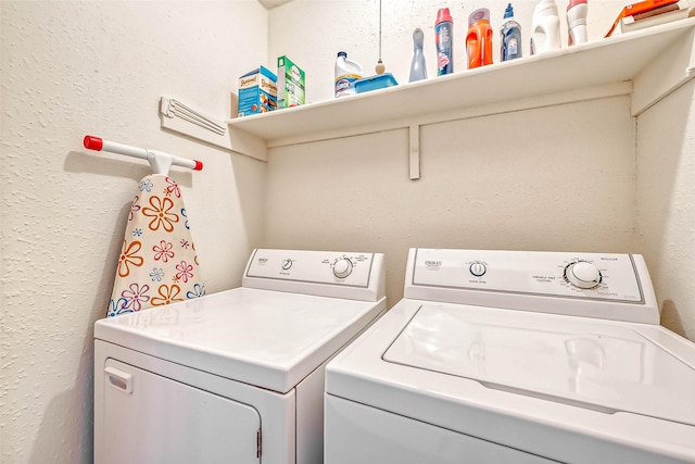 laundry room featuring washing machine and clothes dryer