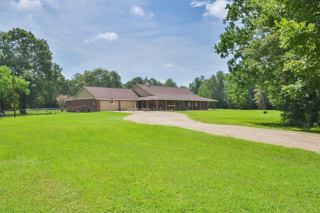 ranch-style house featuring a front lawn