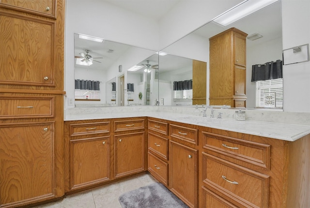 bathroom with ceiling fan, tile flooring, and vanity