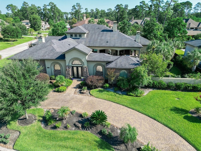 mediterranean / spanish house with a front yard