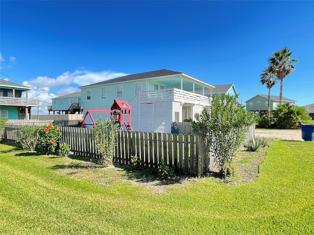 view of home's exterior featuring a lawn and a pergola