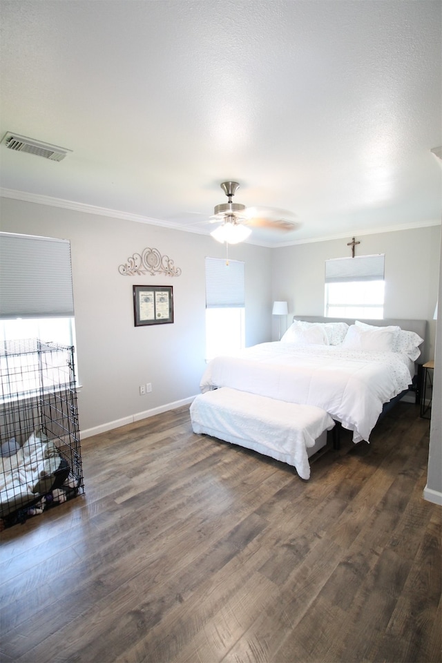 bedroom with dark hardwood / wood-style flooring and ceiling fan