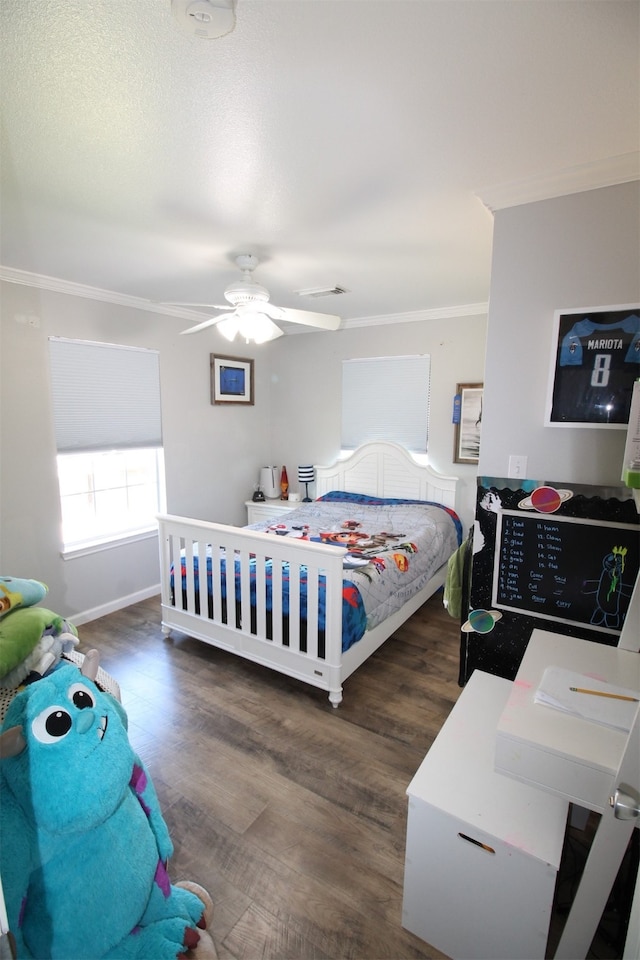 bedroom featuring ornamental molding, ceiling fan, and dark hardwood / wood-style flooring