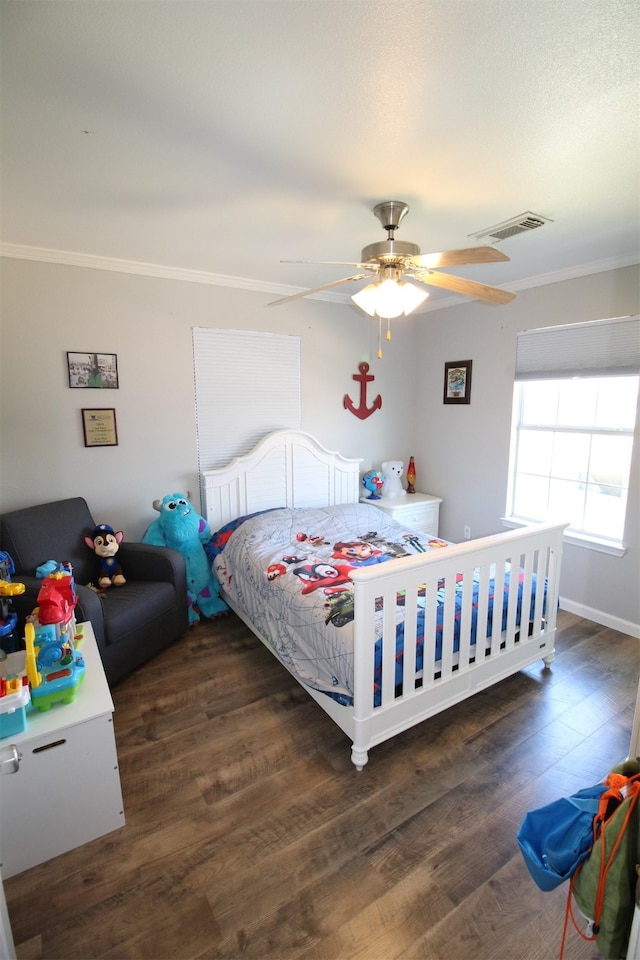 bedroom featuring ceiling fan, ornamental molding, and dark wood-type flooring