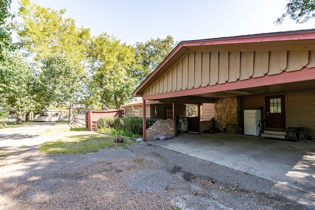 exterior space with a carport