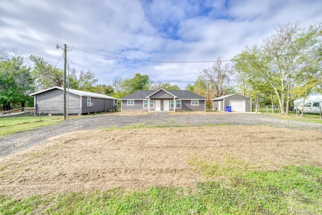 ranch-style house featuring a front lawn and a garage