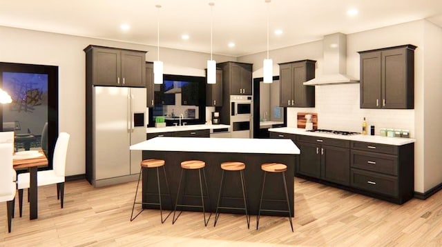 kitchen featuring custom range hood, a kitchen island, decorative light fixtures, and white refrigerator with ice dispenser